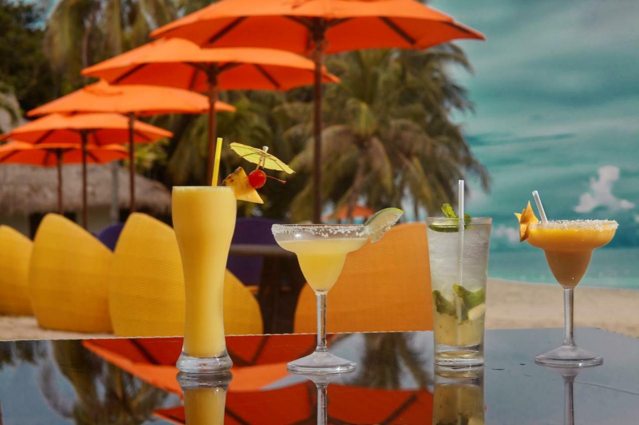 Oceanica Resort Panglao, Bohol Bagian luar foto A selection of cocktails